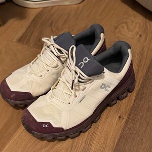 On Running White and Purple Athletic Shoes